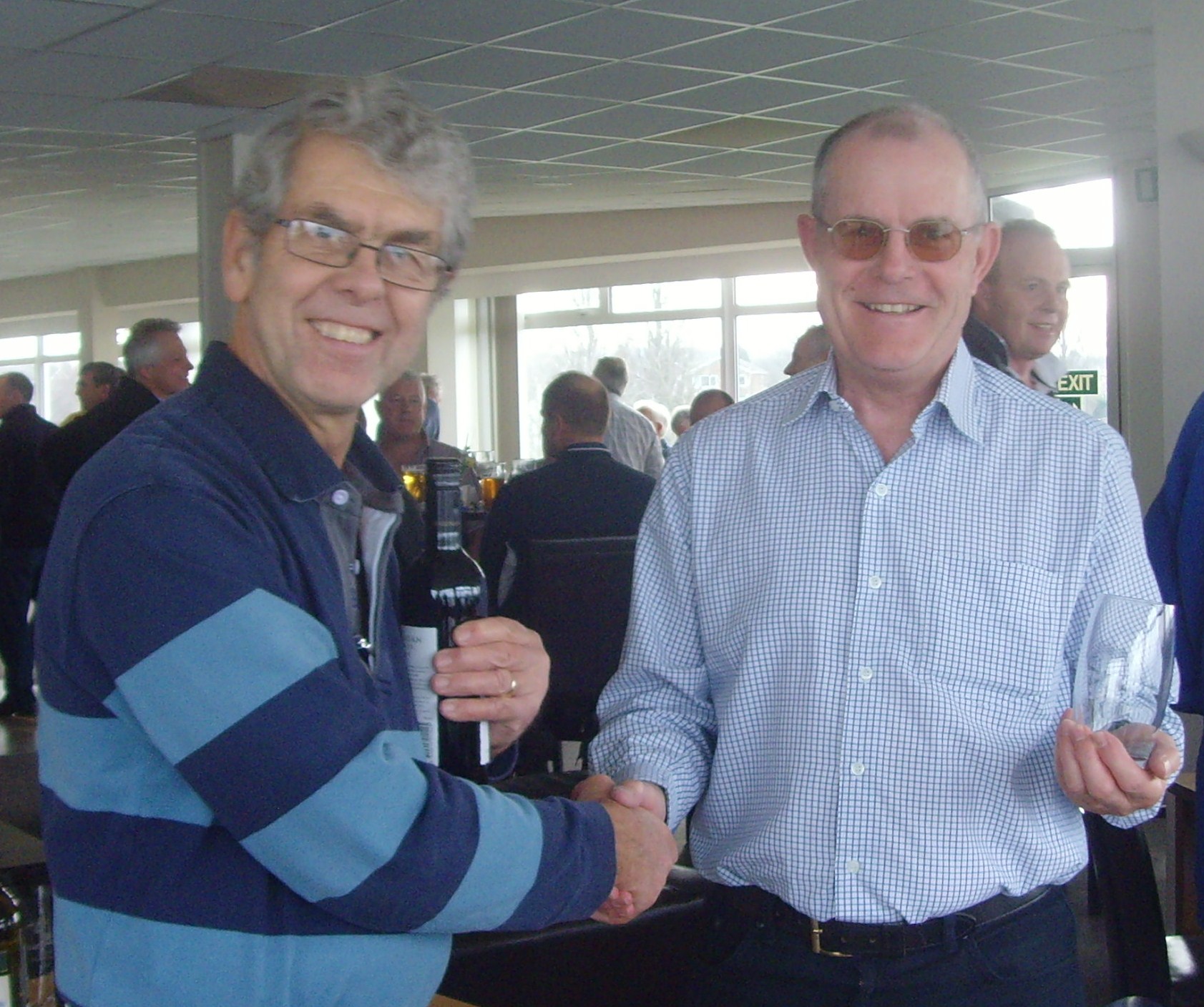 Stuart Snell receives his prize from Bob Carter